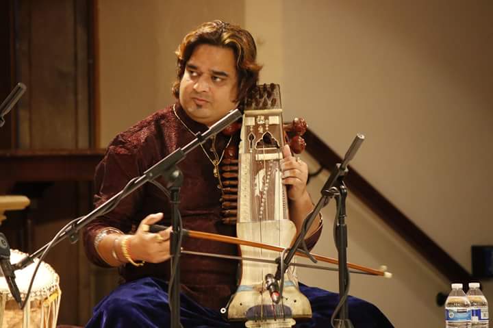 Sri Pankaj Mishra plays the sarangi on stage